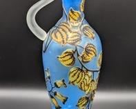 Galle Cameo Glass Pitcher (Reproduction). Lovely blue and yellow floral pitcher measures 18.5” high and 5” wide at the top.