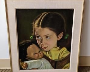 Framed Oil on Board Painting. Depicts an adorable pouting child holding her doll. Measures 20.5” x 25”.