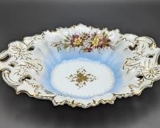 Vintage German Painted Porcelain Bowl. There is a hairline crack that can be seen in the photos. Measures 9” x 13” and 2.5” high. 