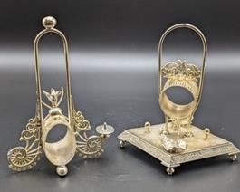 Silver Plated Victorian Holders. The one on the left is damaged and missing a piece. The largest on the right measures 7” high and 7” wide.