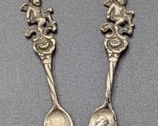 Two Vintage Sterling Silver Cherub Salt Spoons. Marked sterling and each measures about 2” long.