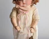 1985 Butler Repo Doll. Includes the adorable purse and woven hat! Measures 12” high.