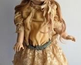 1980 Butler Reproduction Doll. There is some wear on her shoes that can be seen in the photos. Measures 18” high.