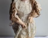 984 Butler Reproduction Doll #2. Marked Bruu/#13. There is some wear to her hair and shoes that can be seen in the photos. Measures 26” high.