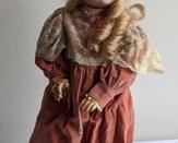 1979 Butler Reproduction Doll. Looks to be in great condition  and includes the adorable outfit. Measures about 15” high.