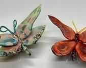 These are stunning! The largest of these amazing art glass butterflies measures 4.5x2x2.5 inches. One of the butterflies has a broken leg but this does not affect the beauty throughout.