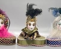 These fancy ladies with porcelain faces measure 5 inches tall.