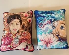 The largest of these needlepoint pillows measures 14x17 inches.