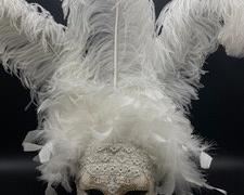 Amazing Mask by Flavia Atteller measures 19 inches from the top of the feathers to the bottom of the mask.