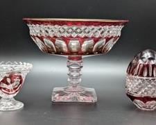 Vintage Cranberry Glassware. Includes a footed bowl, small cup and pretty egg! The footed bowl measures 5.5” high and 7” in diameter.