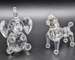 Crystal Elephant and Poodle Figurines. The largest measures 3.5” high and 2” wide.