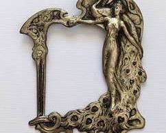 Figural Art Nouveau Brooch. There are no markings, and it appears to be a miniature silver-plated frame that has been repurposed into a brooch. Measures 2" wide and close to 3" high