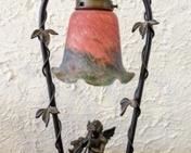 Bronze Cherub Table Lamp. Colorful glass lampshade! The lamp is in working order and measures 19” high and 7” wide at the top