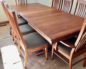 LJ Gascho Furniture Company Arts and Crafts Style Dining Table with 8 Chairs.What a classy dining table and chairs! This LG Gascho Furniture Company table is pictured with 2 of the 4 leaves inserted. The table as shown measures 93x40x30 inches. Each of the 4 leaves measures 12 inches. There are 8 chairs included with two of the chairs being captains or host chairs.