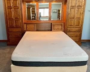 Wowza! This waterbed has an amazing headboard with tons of storage, pull out side tables, lights, mirrors and more! The headboard measures 124x78x19 inches. This item is very heavy. The winning bidder will need to bring the necessary tools to dismantle and drain this item. Please make sure to bring plenty of help for removal as employees are unable to assist. Thank you.