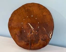 Hand Crafted Wood Slice Wall Clock. This battery operated wall clock is working well and measures 20" wide x 2.5" thick