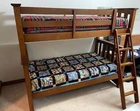 Wooden Bunk Bed Set measuring 69 tall x 81 wide x 44 inches deep. The pictured bedding is not included with this set. This set can be re-configured to make two twin beds