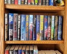 Dale Brown book selection includes 23 hardcover books with jackets, 15 standard-sized softcover books & 6 somewhat larger softcover books.
