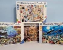 4 Ravensburger puzzles, featuring:

5000-piece 40" x 60" finished size Sealife puzzle;

3000-piece 32" x 48" finished size Safari Life puzzle;

2000-piece 29 1/2" x 38 1/2" finished size Disney Stamps puzzle;

3000-piece 32" x 48" finished size Sealife puzzle.

All pieces appear to be included, but have not been counted