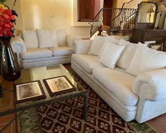 Rustic Entertainment Unit, Iron and Glass End Tables, Iron and Glass Coffee Table, Sofa and Loveseat, Area Rug, Table Lamps, Pottery