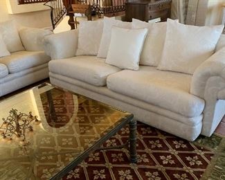 Rustic Entertainment Unit, Iron and Glass End Tables, Iron and Glass Coffee Table, Sofa and Loveseat, Area Rug, Table Lamps, Pottery