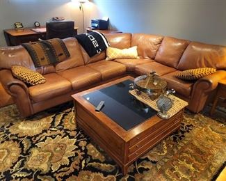 Gorgeous leather sectional in excellent condition! Floor rug, Display coffee table. Fish theme pendant light