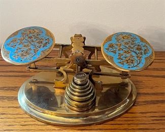 Item 24:  English c. 1860 S. Gutter & Son Edinborough, very rare brass postal scale with hand engraved scale pans decorated with powder blue champleve enamel.  Set on an oval brass base with a complete matching set of brass weights - 8" x 3.5": $1295