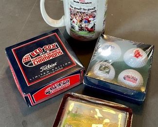 Item 99:  Lot of Red Sox golf balls, coffee mug, and paperweight:  $24