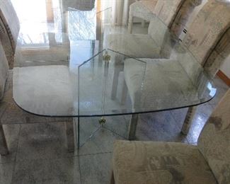 Glass dining room table with 8 chairs $550