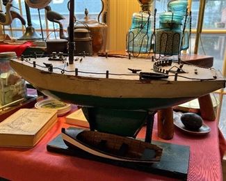 Old wooden sailboat on stand