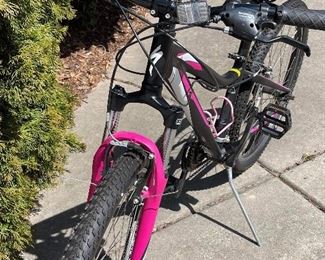 Girls bicycle with a helmet