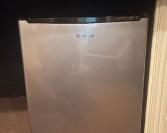 Small Whirlpool mini fridge. Measures 19 inches wide by 19 inches diameter by 24 inches high sides are black furnace stainless steel