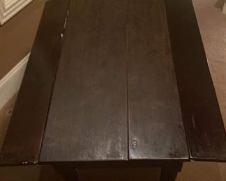 Small dark wood antique table with 2. 6 inch leaves