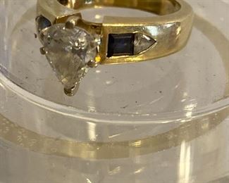 Diamond flanked by sapphires 