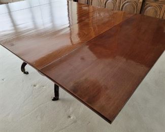 Antique Wood Table Comes with 2 leaves Has 4 swing legs on casters