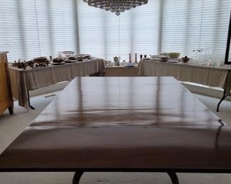 Antique Wood Table Comes with 2 leaves Has 4 swing legs on casters