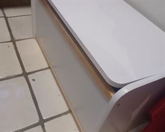 Wooden toy box with toys and books