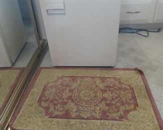 Mini fridge and entry rug