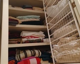 Linens Lot with storage rack