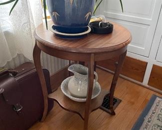. . . an antique lamp table -- notice pitcher and bowl and planter with aloe plant