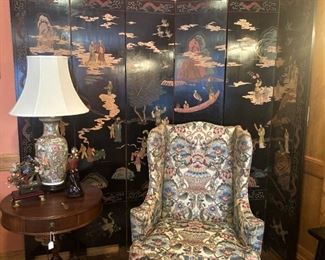 Six paneled Asian screens; one of two matching upholstered wingback chairs; drum table;  Famille Rose  lamp