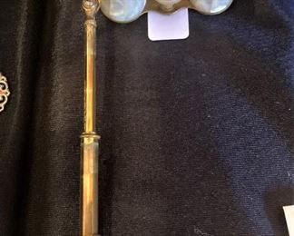 Vintage Mother-of-Pearl opera glasses; these glasses have a hinged lorgnette that allows for one-handed viewing.

