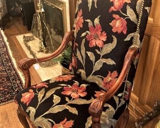 Lovely arm chair with nail-head trim and wood carving