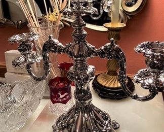 One of two silver plate candelabras 