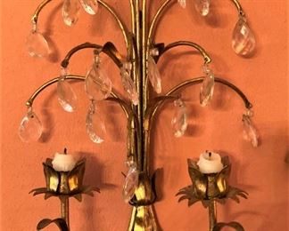 One of two brass candle sconces