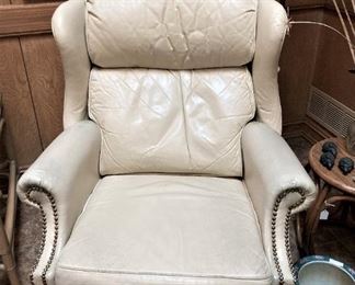 One of two matching ivory recliners
