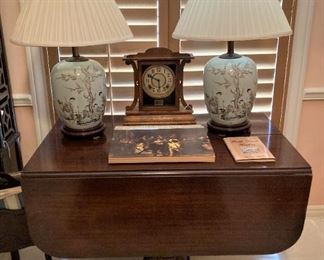Matching lamps; drop leaf Duncan Phyfe table; clock
