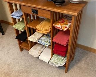 Oak console table with linens