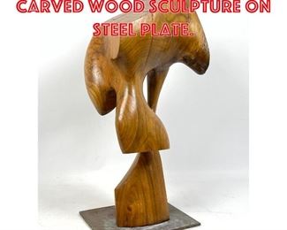 Lot 228 Abstract Modern Carved wood Sculpture on Steel Plate. 