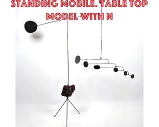 Lot 235 Modernist Metal Standing Mobile. Table Top Model with n